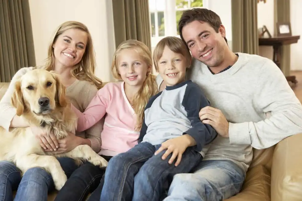 Happy family with dog after a Local residential Carpet Cleaner serviced their home